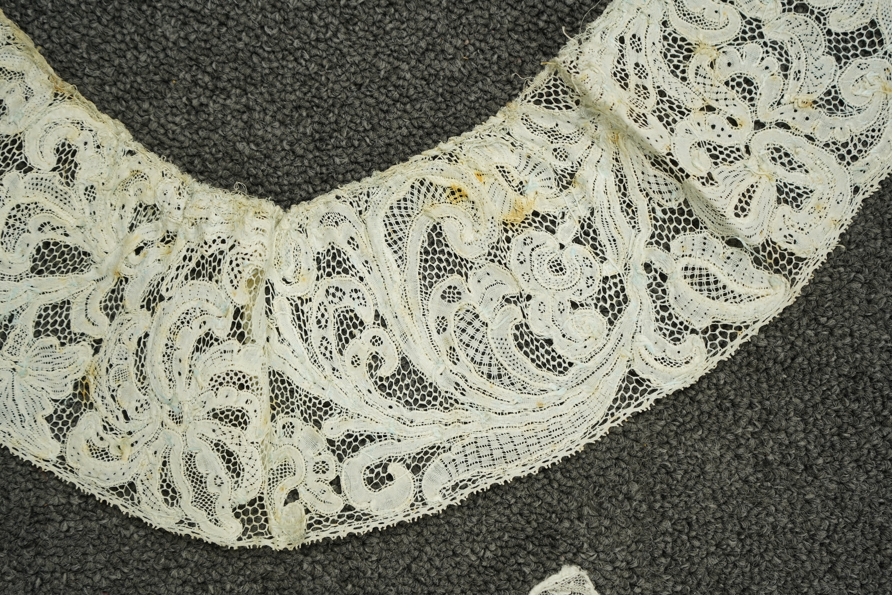 Various lengths of 18th and 19th century lace trimming and two needle run bonnets. Including a collar made from two rows of 18th century Valenciennes lace, a length Valenciennes lace, a shorter length of Pointe de Anglet